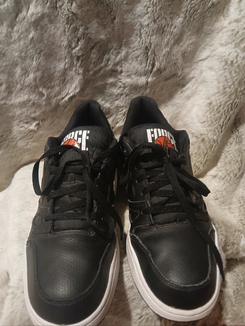 Nike Black Sneakers with White Soles and Orange Tongue Accent